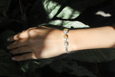 Citrine Byzantine sterling silver bracelet shown worn on the wrist with three golden gemstones.