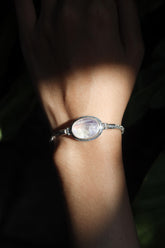 Blue Moonstone sterling silver Byzantine bracelet shown worn on the wrist with strong blue lunar flash.