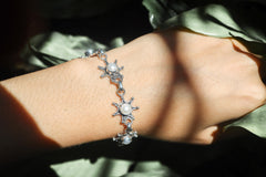 Freshwater Pearl sterling silver bracelet shown worn on the wrist as a luminous bridal-style bracelet.