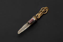 Artistic photo capturing pendant’s depth and dimensional interplay of metals and stones.