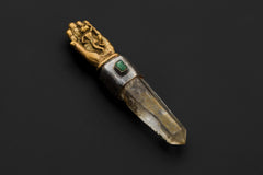 Sun Wukong Buddha Hand talisman shown on a dark background with Himalayan Chlorite Lemurian Quartz and Green Emerald.