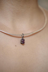 Pink Tourmaline Rubellite pendant shown worn on a silver choker, with oxidized sterling silver setting and small heart-centred crystal detail.