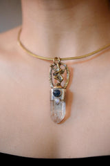 Side view of pendant on model showing depth of setting and layered stone arrangement.
