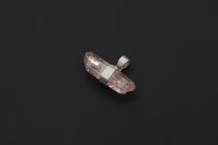 Double terminated Vera Cruz Amethyst pendant shown on black background with pale lilac crystal.