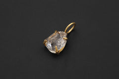 Gold-plated Herkimer Diamond Quartz pendant displayed on black background as a clear crystal talisman.