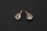 Herkimer Diamond Quartz pendant pair shown on black background with gold-plated sterling silver claws.