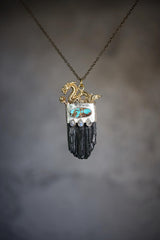 Dragon Black Tourmaline Turquoise Moonstone pendant shown on misty background with sterling silver and protective talisman design.