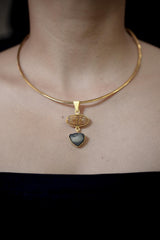 Golden Rutile Quartz Dravite Tourmaline pendant shown worn on the chest, with warm 18k gold plating and two-stone design.