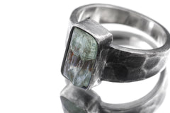 Close-up of Australian Aquamarine men’s ring showing square blue mineral specimen and thick hammered silver bezel.