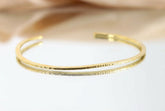Gold-plated brass open choker with fine textured surface, shown on a light background as a minimalist collar necklace.