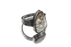 Black Rutile inclusion Quartz ring displayed on white background with bold sterling silver setting.