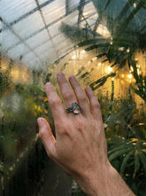 Smoky Quartz Golden Rutile men’s ring in oxidized 925 sterling silver shown worn on the hand with hammered texture.