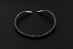 Oxidized sterling silver mesh choker displayed on dark background with polished silver end caps.