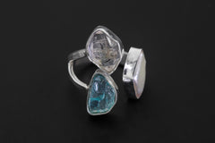 Close-up of adjustable sterling silver ring with Herkimer Diamond crystal, marquise Pearl, and raw Blue Apatite stones.