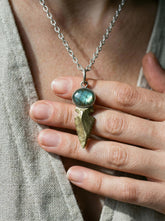 Labradorite Obsidian spearhead pendant worn on adjustable cord with sterling silver and brass setting.