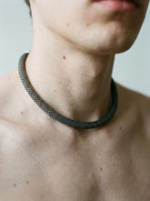 Sterling silver mesh choker shown worn on model as an oxidized flexible collar necklace.