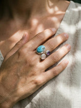 Ocean Heart Multi Stone Ring shown worn on hand with Larimar, Amethyst, Rose Quartz, and adjustable sterling silver band.