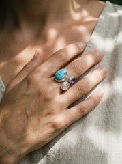 Ocean Heart Multi Stone Ring shown worn on hand with Larimar, Amethyst, Rose Quartz, and adjustable sterling silver band.
