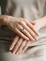 Amethyst geometric silver ring shown worn on hand as a refined handmade statement ring.