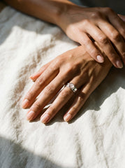 Eternal Rose Quartz Hammered Ring shown worn on hand with pale pink stone and shiny textured silver.