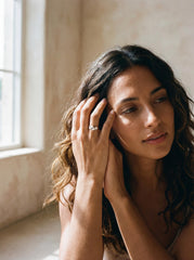 Crystal Clarity Herkimer Diamond Ring shown worn with raw Herkimer Diamond Quartz and sculpted silver setting.