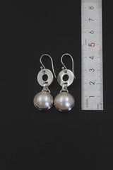 Pearl sterling silver drop earrings shown beside a ruler for approximately 3.5 cm length reference.