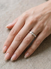 Petite Herkimer Diamond Ring shown worn on hand with hammered sterling silver band and raw clear Quartz crystal.