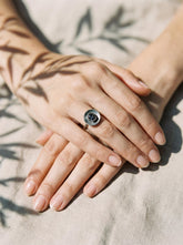 Raw Sapphire Silver Dome Ring shown worn on hand with textured sterling silver and central raw gemstone.