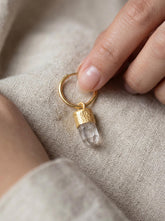 Golden Lemurian Quartz convertible hoop earrings in 16k gold-plated 925 sterling silver shown worn on a model.