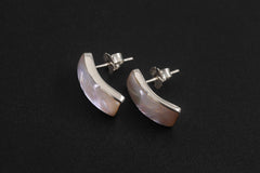 Mother of Pearl sterling silver stud earrings displayed on dark background with curved shell inlay.