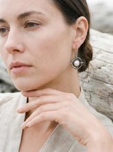 Old World South Sea Pearl statement earring in layered 925 sterling silver shown worn on a model.