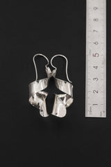 Silver Tide Curl Earrings shown beside ruler for approximately 4.5 cm total drop length reference.