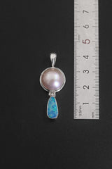 Pearl Blue Opal sterling silver pendant shown beside a ruler for approximately 2 x 4 cm size reference.