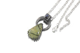 Blue Moonstone Peridot heirloom pendant shown on white background with oxidized sterling silver brutalist claw setting.