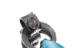 Close-up of Larimar accent set into the bail of oxidized sterling silver Blue Moonstone pendant.