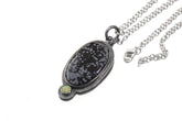 Dalmatian Jasper Ethiopian Opal sun pendant shown with sterling silver chain and textured handmade silver setting.