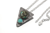 Turquoise Triangle Spirit Pendant displayed with silver chain on white background.