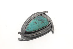 Australian Chrysocolla triangle pendant shown on white background with oxidized sterling silver sun-ray detailing.