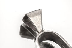 Close-up of triangular sterling silver bail and U-shaped holder on Rhodochrosite rotating pendant.
