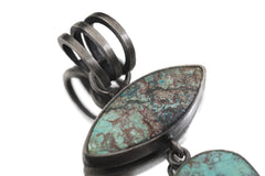 Close view of upper matrix Turquoise stone and multi-loop oxidized sterling silver bail.