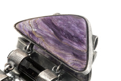 Charoite and Black Tourmaline heirloom pendant shown on a white background with hinged sterling silver construction.