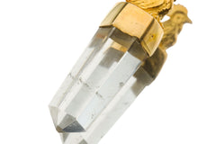 Close-up of Clear Quartz Generator Crystal in a rooster-inspired talisman pendant with gold-toned setting.