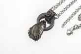 Blue Moonstone Black Rutile Quartz pendant on white background with oxidized sterling silver claw setting and chain.