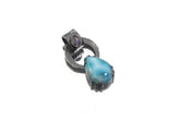 Blue Moonstone Larimar pendant on white background with oxidized sterling silver claw setting and large circular bail.