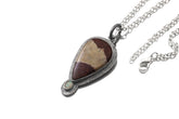 Mookaite Ethiopian Opal sterling silver pendant shown with chain and sun-inspired handmade silver setting.