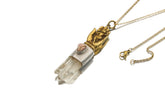 Sun Wukong Buddha Hand Quartz Amethyst pendant shown worn on a model, with brass figurework and clear crystal point.