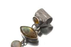 Close-up of Ethiopian Opal, eye-shaped Labradorite, Blue Moonstones in oxidized sterling silver.
