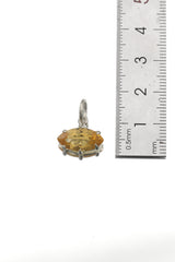 Citrine marquise pendant shown beside ruler for petite gemstone pendant size reference.