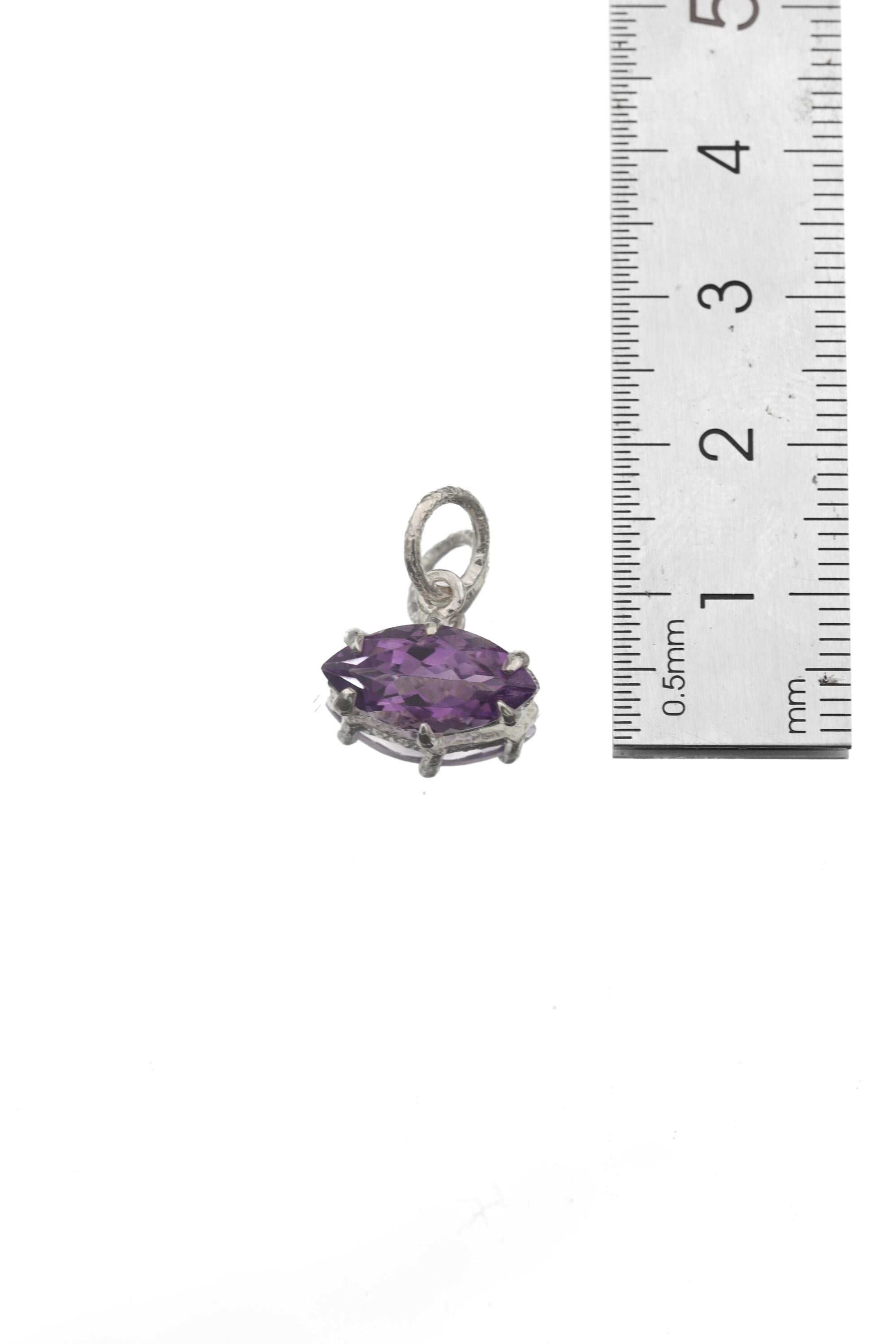 Amethyst marquise pendant shown beside ruler for petite gemstone pendant size reference.