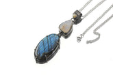 Ethiopian Opal Moonstone Labradorite pendant shown on a white background with oxidized sterling silver and celestial stone layout.